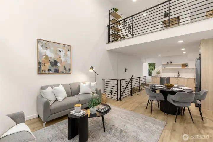 Elegant dining space situated perfectly between the kitchen and living room, framed by architectural stair details.