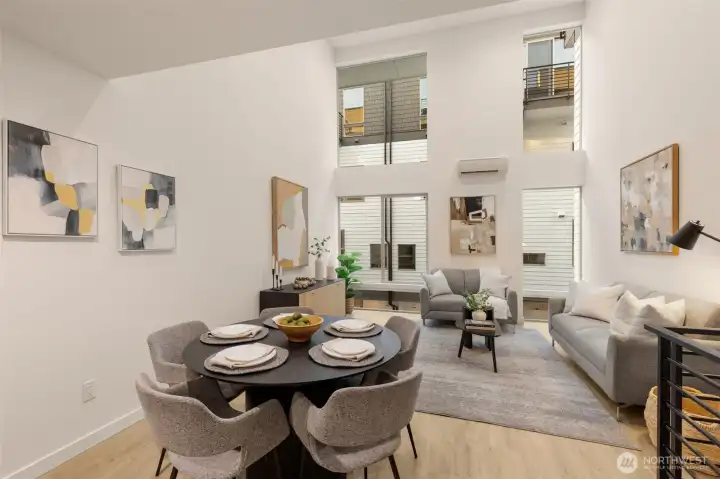 Looking back from the dining area toward the living space, emphasizing the home's spacious, modern layout.