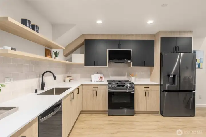 Highlighting the custom cabinetry and professional-grade appliances that define this luxury kitchen.