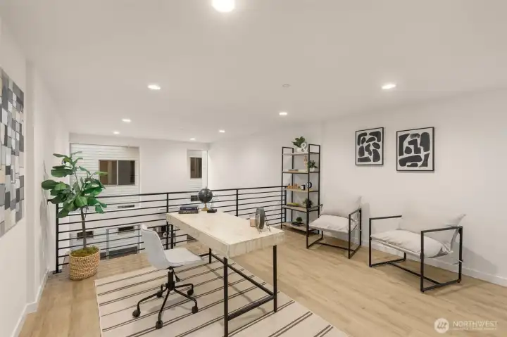 Architectural glass and iron railings add a touch of modern elegance to the transition between levels.