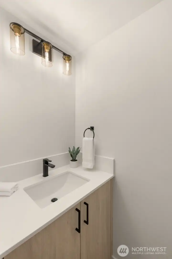 Well-appointed additional bedroom with plenty of natural light and closet space.