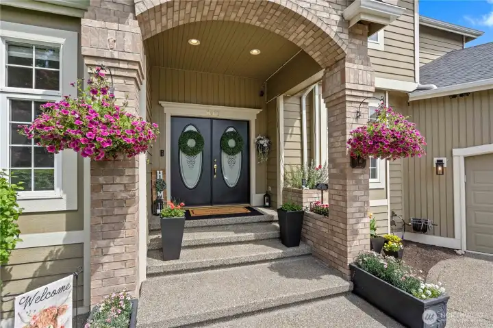 Welcome to this gracious entryway with double doors