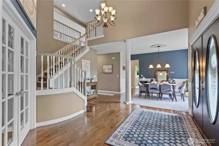 Enter to soaring two story ceiings and formal spaces