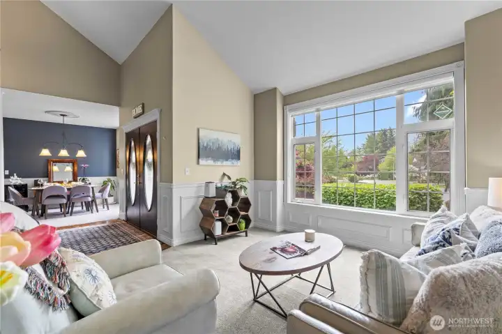 Huge windows let the light stream into this formal living room