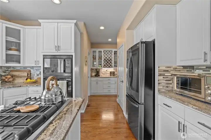 Just a peek to the butlers pantry with laundry room to the left