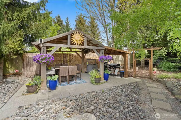 This covered patio is designed to live and enjoy wiht a TV and ceiling fan!