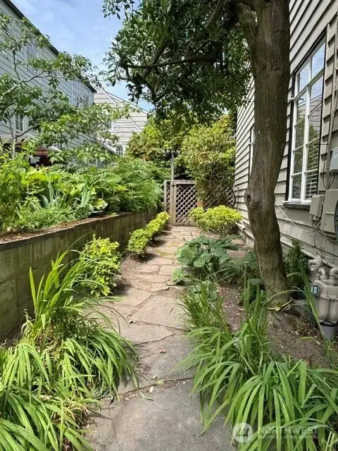 West side walkway to back gardens. West side walkway to back gardens.