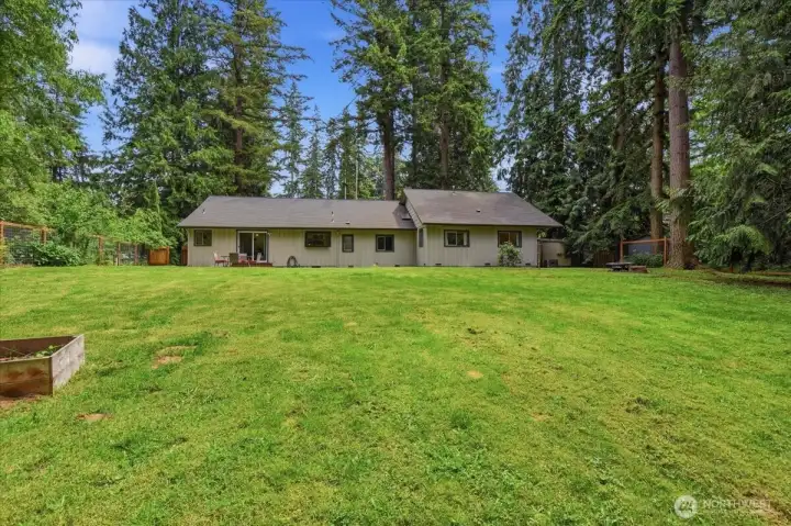 Fully Fenced Backyard, Mature Landscaping creates a Private Setting