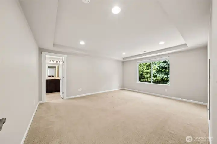 Primary bedroom with tray ceiling Primary bedroom with tray ceiling