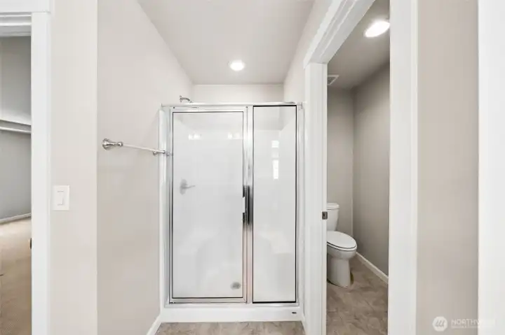 Primary bathroom shower and enclosed toilet room Primary bathroom shower and enclosed toilet room