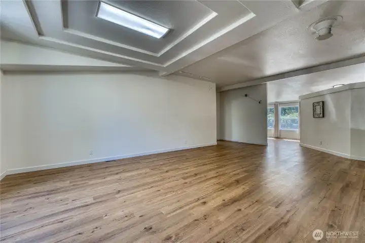 Upon entering, the view is of the entrance to the primary bedroom and the dining room