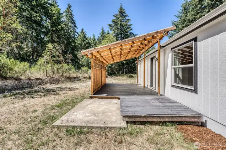 Off the back of the home is a place for a hot tub and covered patio for evening events