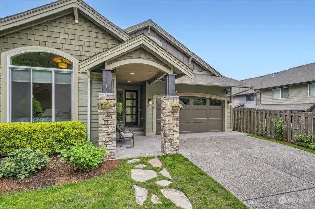 Classic Craftsman charm with tall doors and covered entry