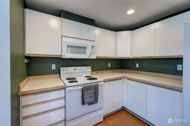 Plenty of countertop space and cabinets.