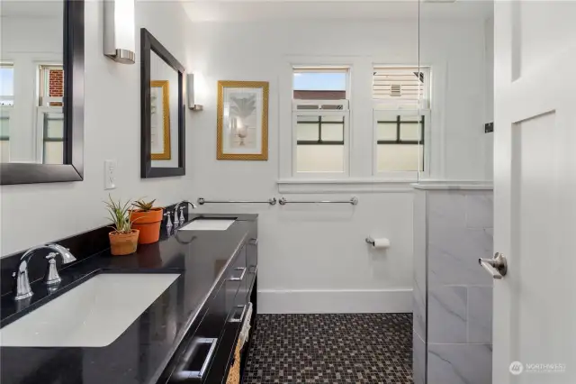 Primary bedroom en suite bath with heated floor and double vanity