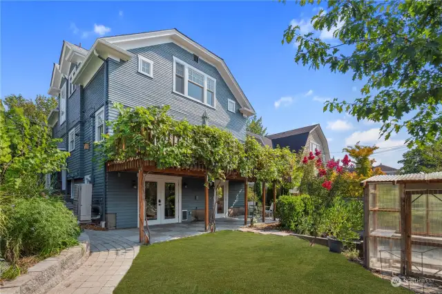 Handicap access from the back parking pad through the yard into the lower level -- no stairs required.  Green house conveys with home.