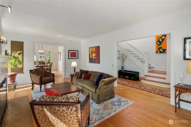 Large and lightfilled living room open to the entry hall and dining room