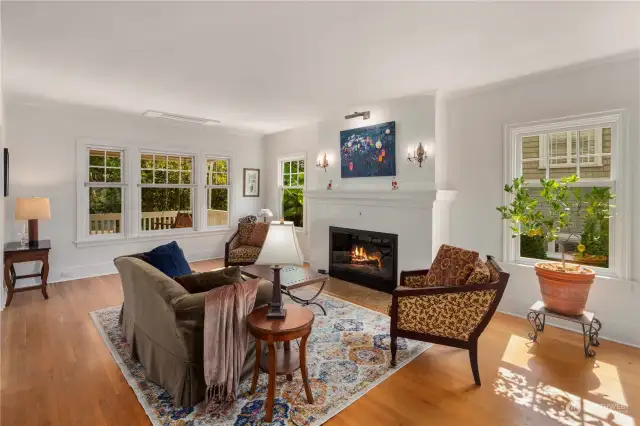 Updated original fireplace with gas logs.  All windows have been replaced with double paned windows.  Beautifully refinished hardwood floors.