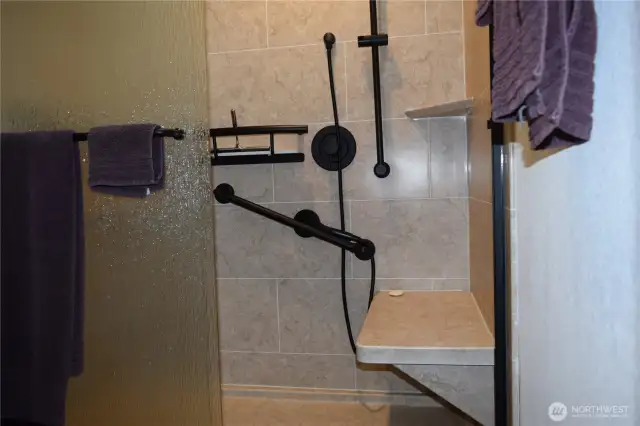 Stone walk in shower with all matte black fixtures