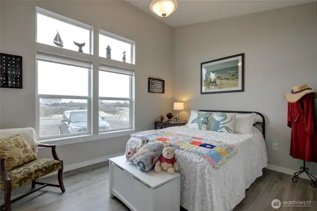 Spacious guest bedroom faces the front of the home.