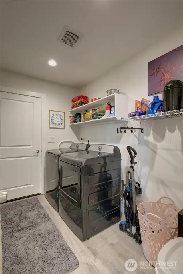 Then the laundry room, with additional storage space and garage access.
