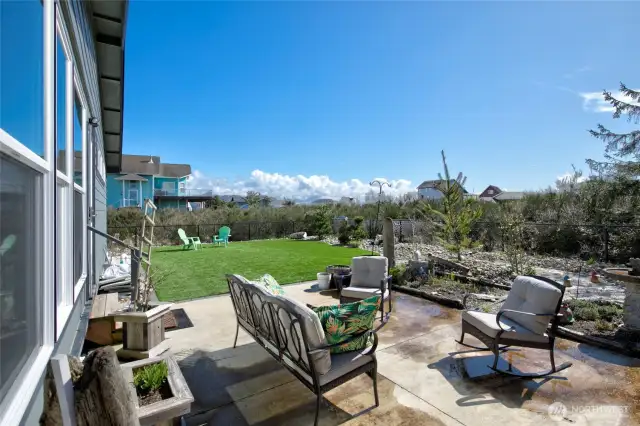 The back yard boasts a nice patio and lovely outdoor oasis.
