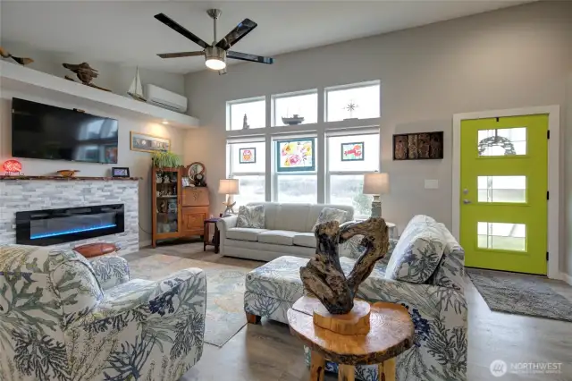 From the dining space, you have high ceilings, big windows, and the gorgeous electric fireplace.