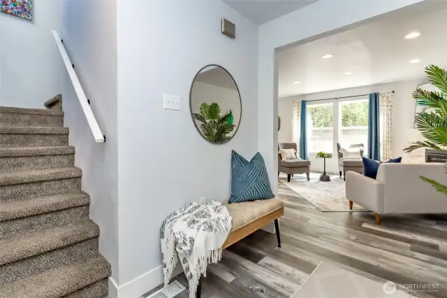 Step into a spacious entryway adorned with a neutral palette, perfectly suited to complement any décor style.