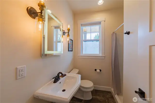 Main level 3/4 bathroom that has a shower.