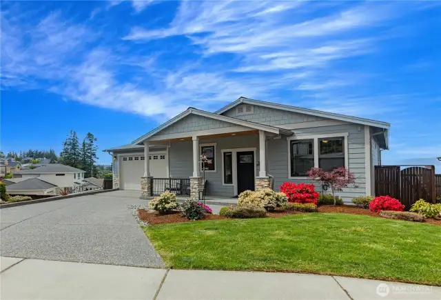 Street view of the house on a corner lot with view