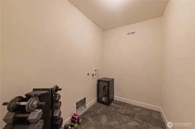 Downstairs FULL SIZE side by side laundry room with extra space