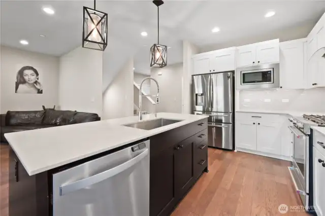The main level showcases a bright, open floor plan with tall 9.5-foot ceilings
