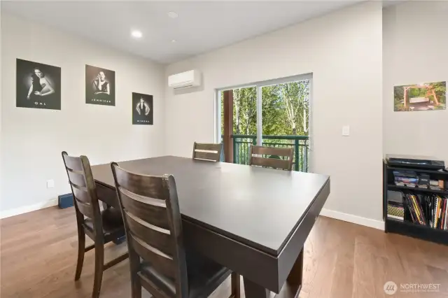 The dining area offers a stunning view of the surrounding wilderness