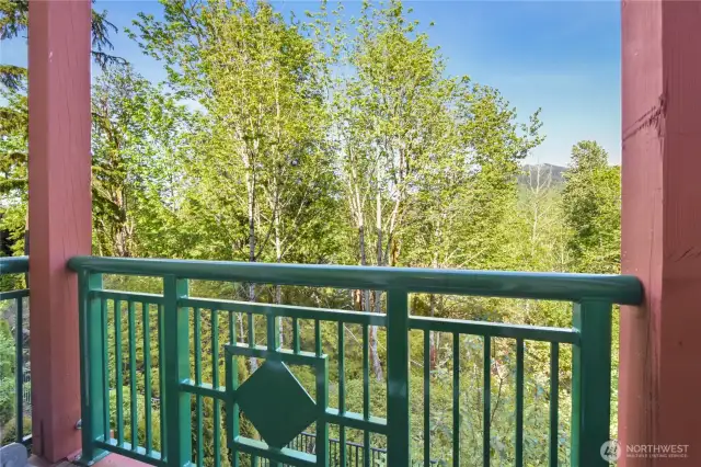 quiet balcony overlooking a serene greenbelt, offering a peaceful retreat with a deep connection to nature