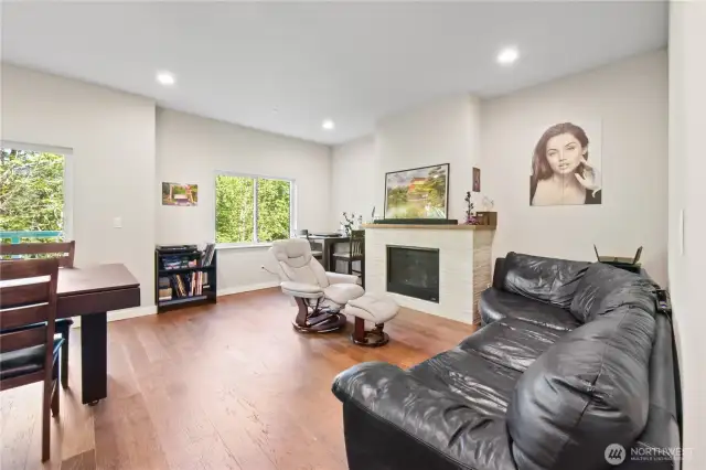 The living room features a cozy gas fireplace, adding warmth and ambiance to the space