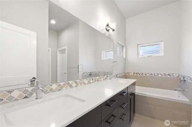 Primary Bathroom with Tub and Shower