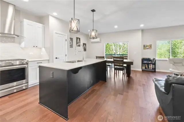 The main level boasts an open floor plan seamlessly connecting the kitchen, dining, and living room — ideal for entertaining and everyday living