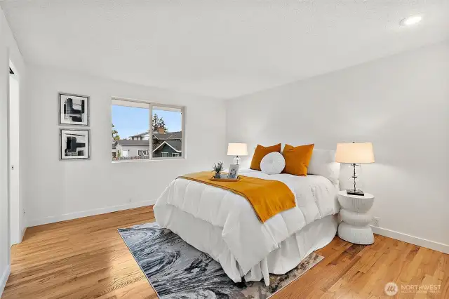 Serene and spacious primary suite with ample natural light and ensuite bath with heated tile floors.