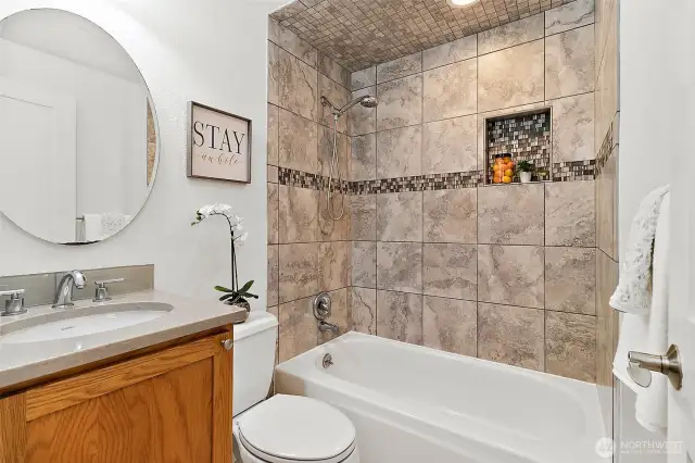 Bright and beautifully updated with modern finishes—this main bath is both functional and fresh, perfect for daily routines or guest use.