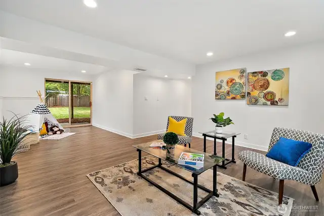 Cozy up by the gas fireplace in this expansive bonus room—ideal for game nights, movie marathons, or relaxing after a long day.