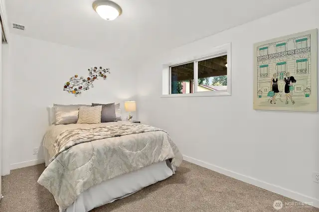 Two additional bedrooms downstairs connected by a Jack & Jill bath—privacy and convenience in one.