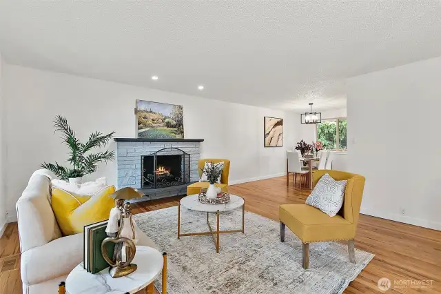 Step inside to a bright, open layout with solid hardwood floors and large windows that fill the space with natural light.