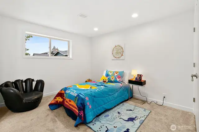 Two additional bedrooms downstairs connected by a Jack & Jill bath—privacy and convenience in one.
