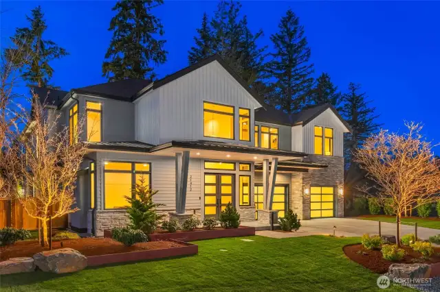Extensive use of landscape lighting creates stunning twilight curb appeal