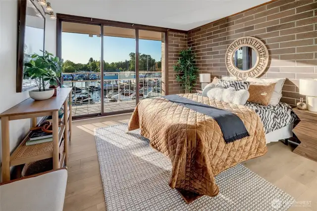This large bedroom also features the brick accent wall.