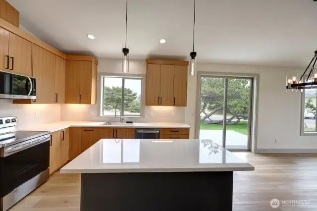 Kitchen with sliding glass door to deck