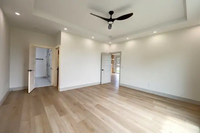 Primary Ensuite showing walkin closet and bath