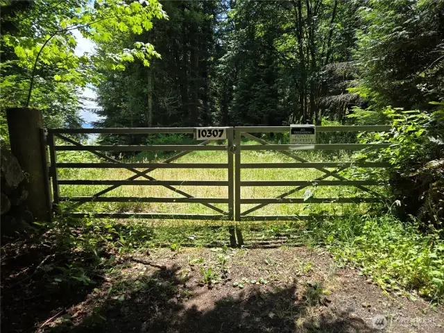 Park here and walk to the Left to get onto the lot. Building site is behind this gate to the left.