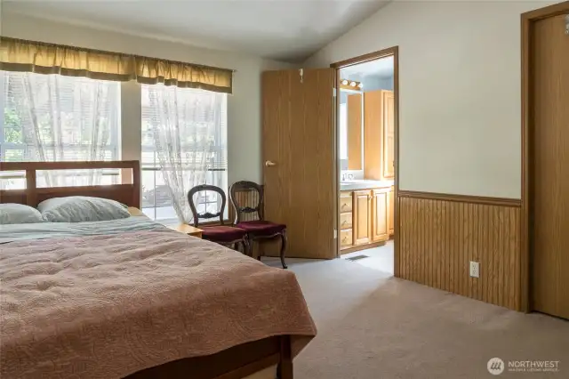 Primary bedroom with full bath right corner and walk=in closet far right.