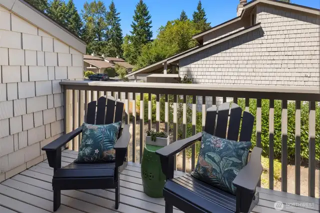 Deck overlooks community green space.